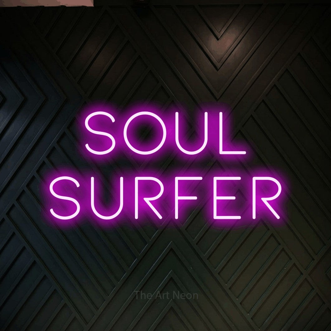 LED neon sign reading “Soul Surfer”, arranged in 2 lines.