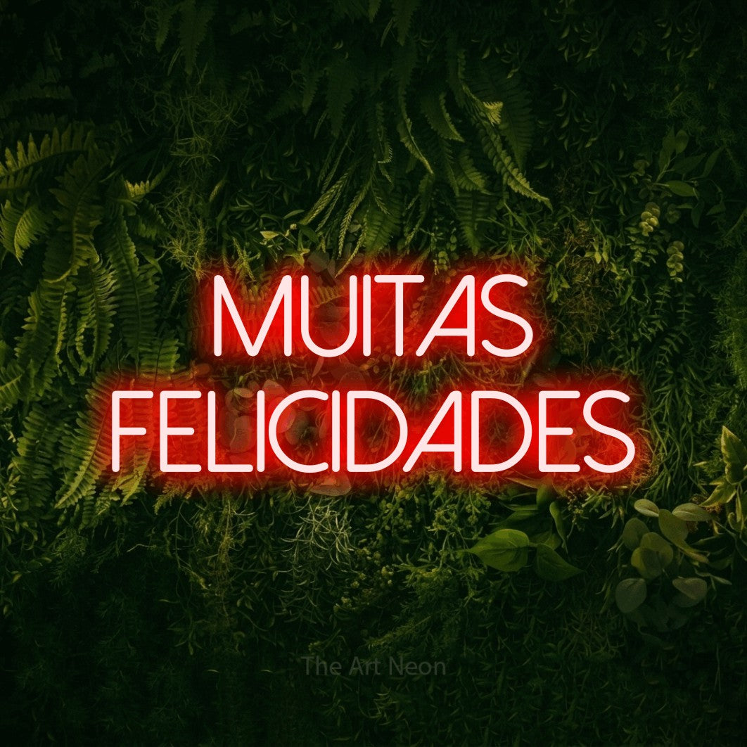 LED neon sign reading “Muitas Felicidades”, arranged in 2 lines.