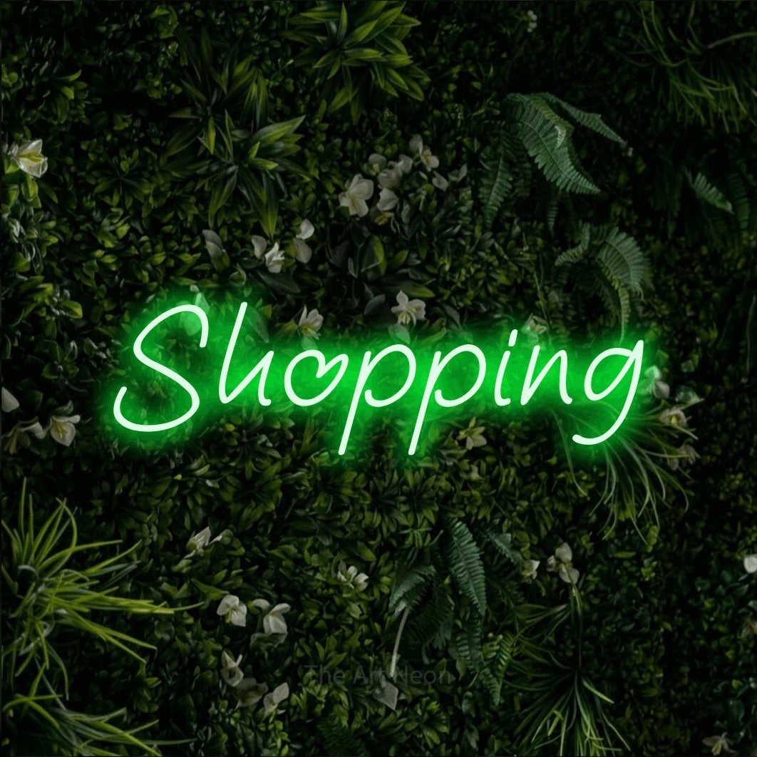 LED neon sign reading “Shopping”, arranged in a single line.