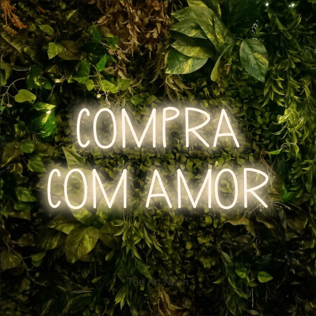 LED neon sign reading “COMPRA COM AMOR”, arranged in 2 lines.