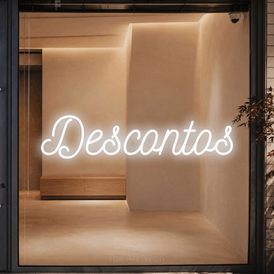 LED neon sign reading “Descontos”, arranged in a single line.