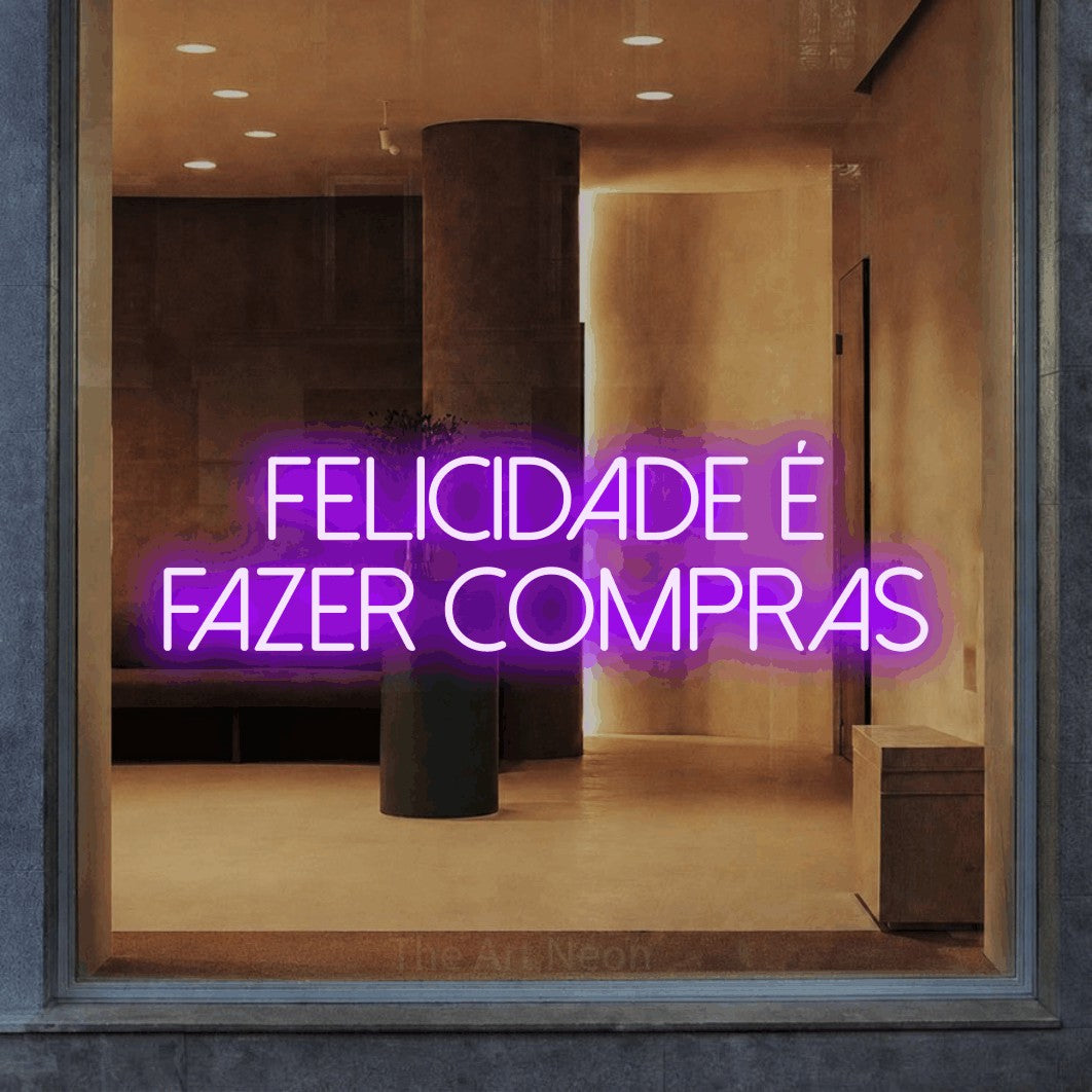 LED neon sign reading “felicidade é fazer compras”, arranged in 2 lines.