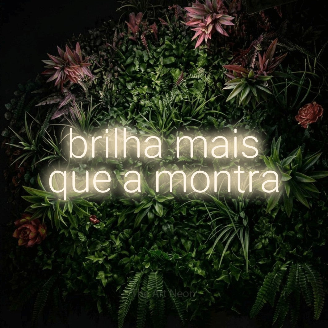 LED neon sign reading “brilha mais que a montra”, arranged in 2 lines.