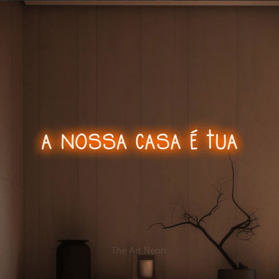 LED neon sign reading “a nossa casa é tua”, arranged in a single line.