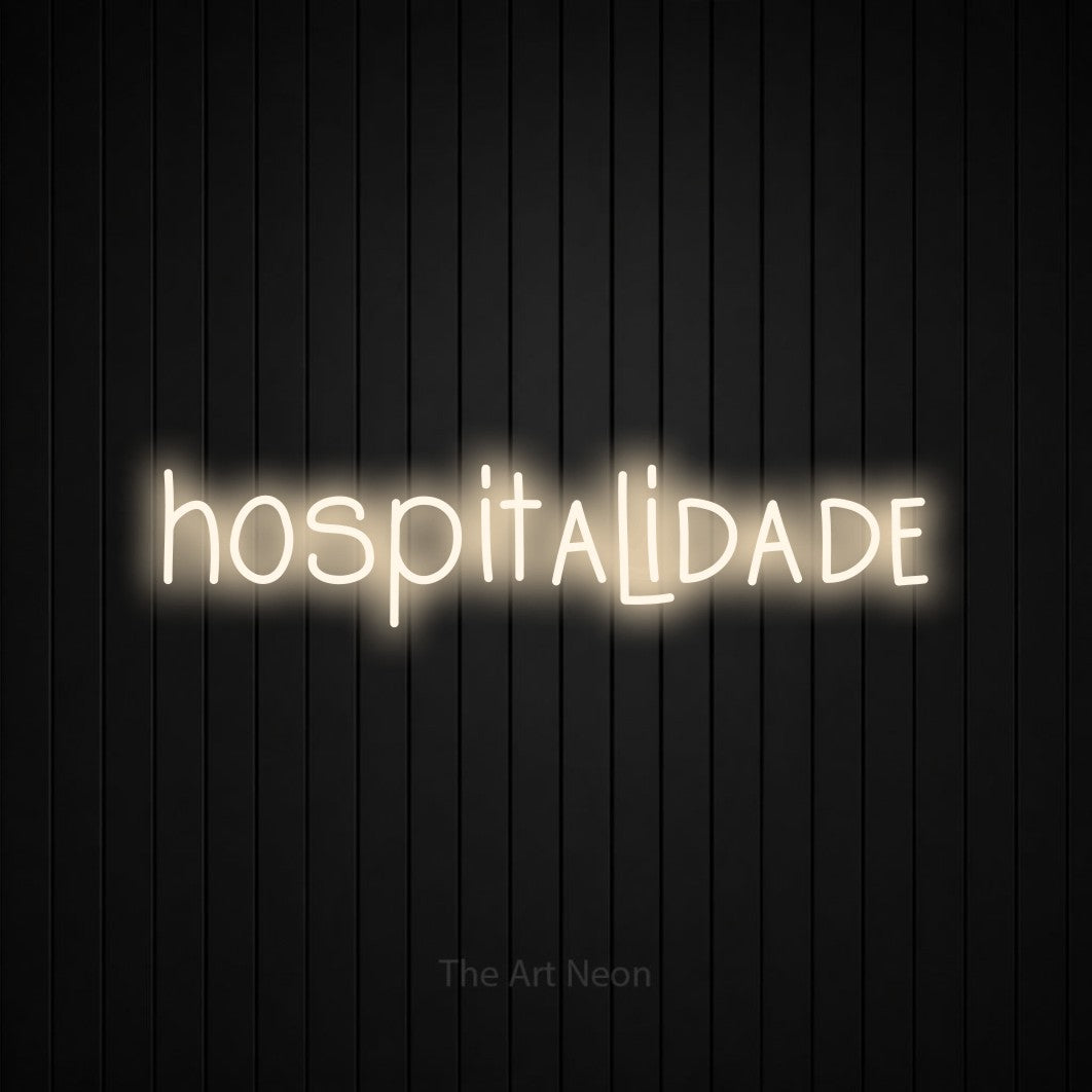 LED neon sign reading “hospitalidade”, arranged in a single line.