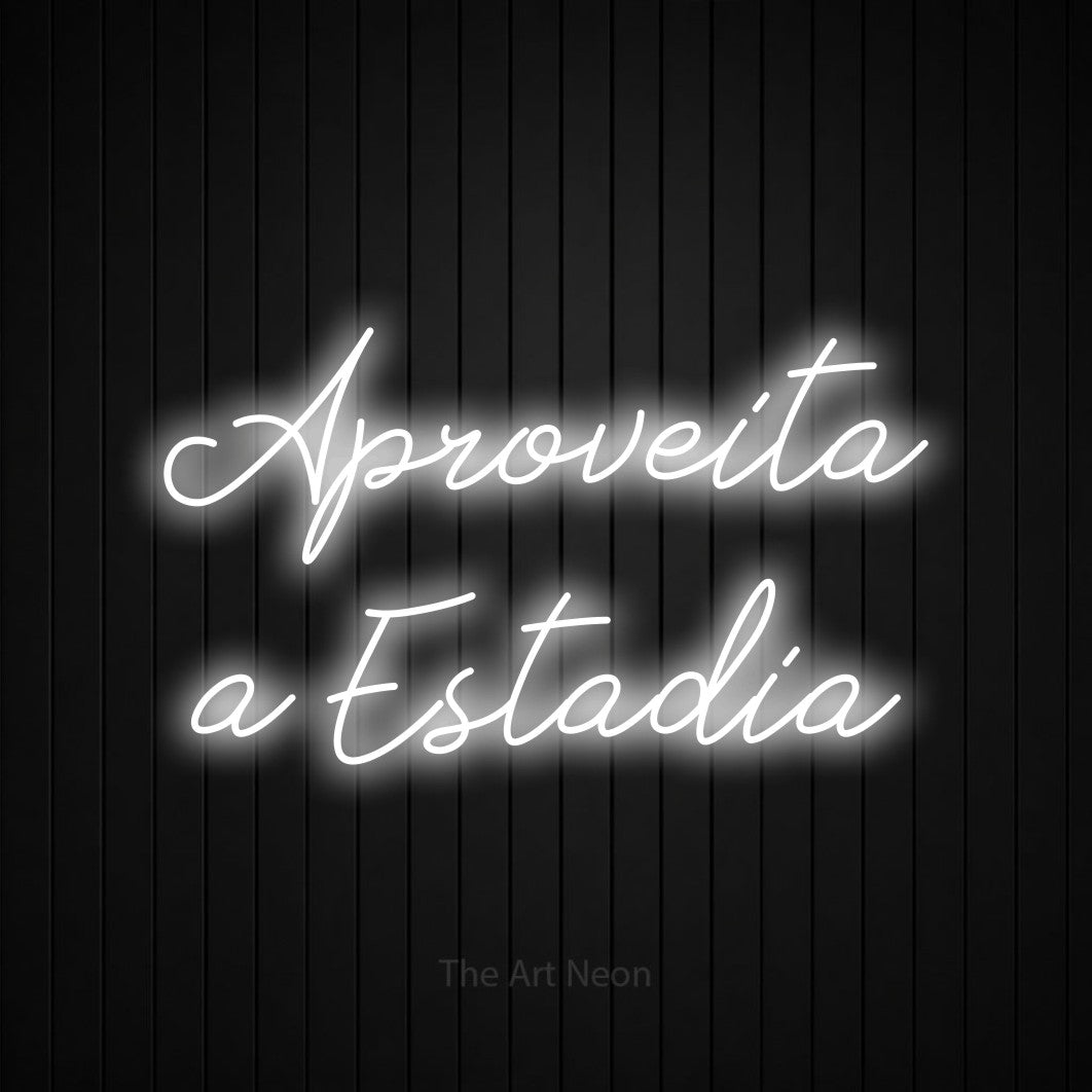 LED neon sign reading “Aproveita a Estadia”, arranged in 2 lines.