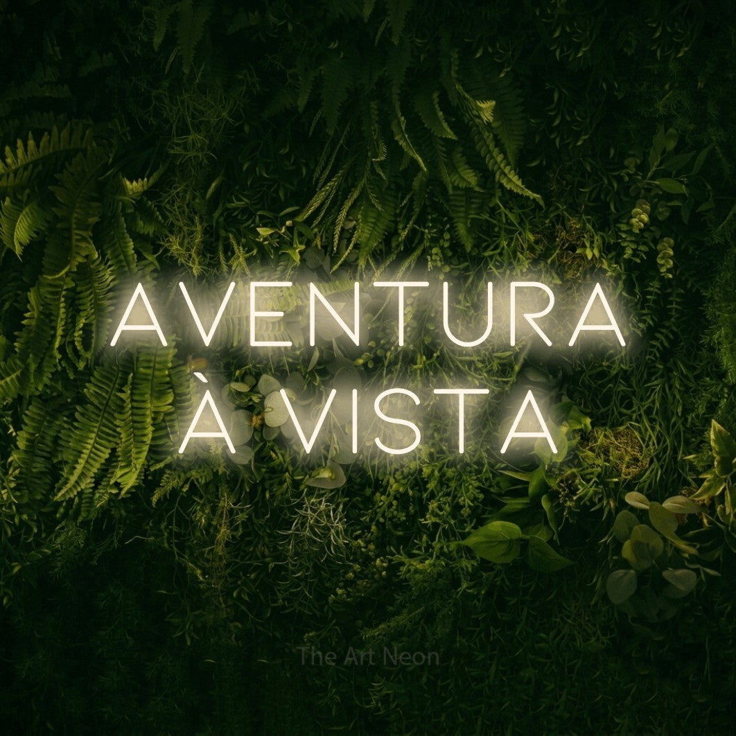 LED neon sign reading “Aventura à Vista”, arranged in 2 lines.