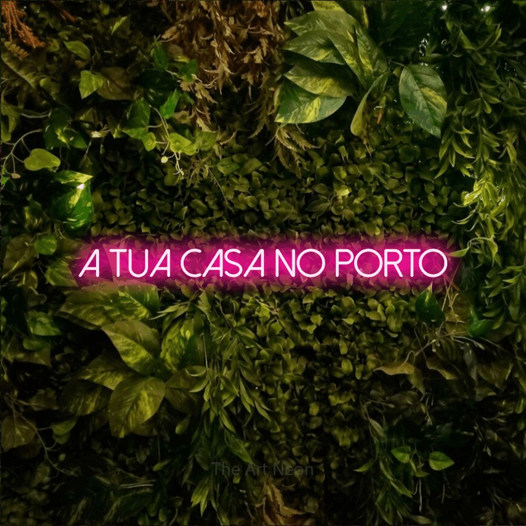 LED neon sign reading “A Tua Casa no Porto”, arranged in a single line.