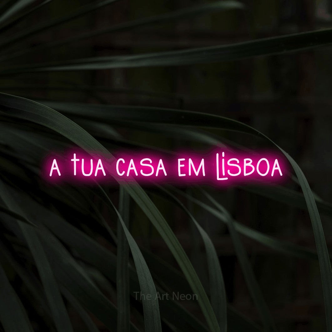 LED neon sign reading “a tua casa em lisboa”, arranged in a single line.