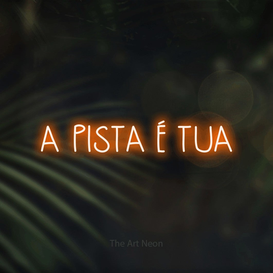 LED neon sign reading “A PISTA É TUA”, arranged in a single line.