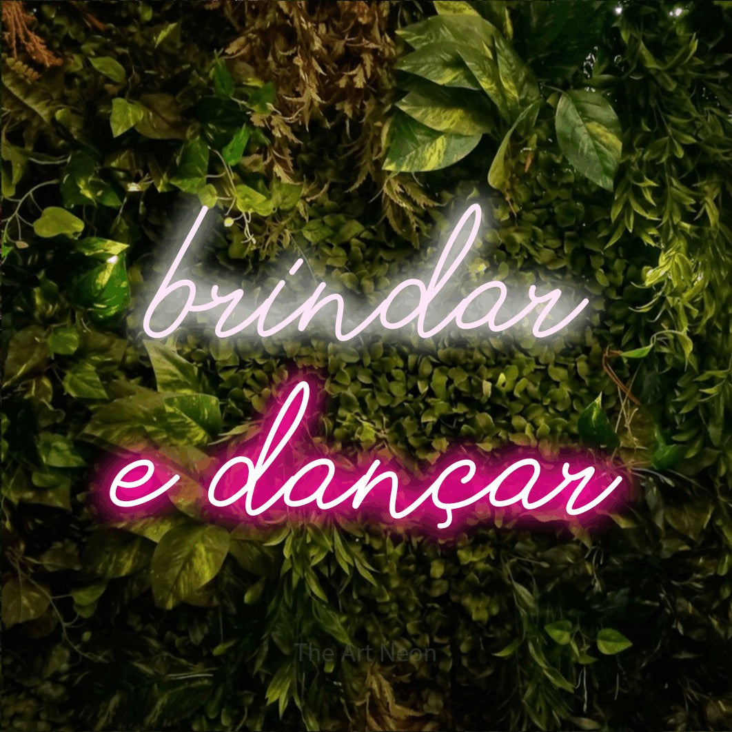 LED neon sign reading “brindar e dançar”, arranged in 2 lines.