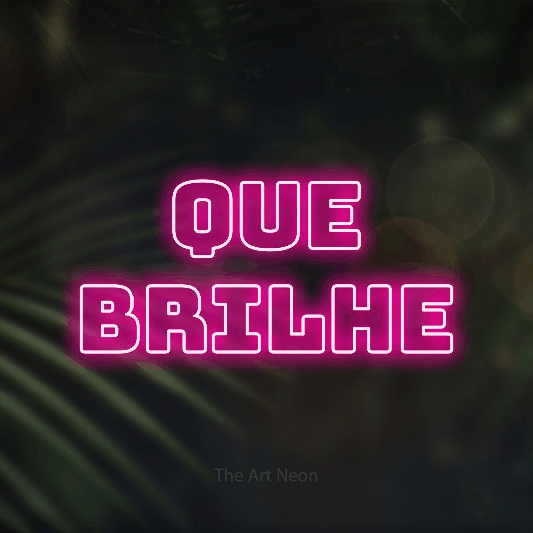 LED neon sign reading “QUE BRILHE”, arranged in 2 lines.