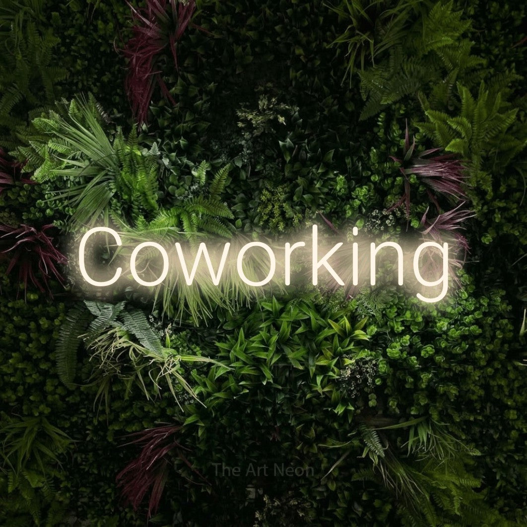 LED neon sign reading “Coworking”, arranged in a single line.