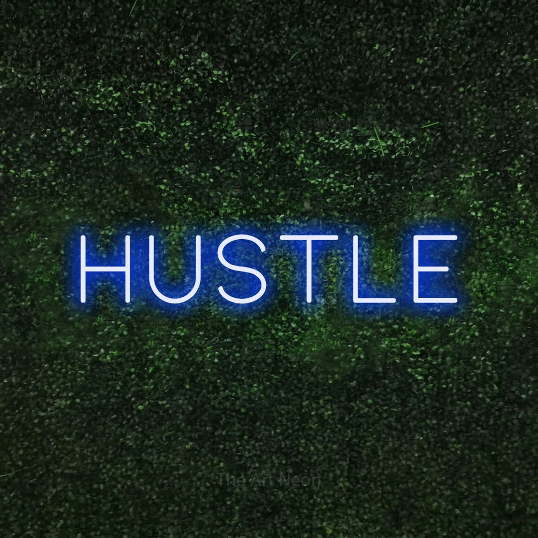 LED neon sign reading “HUSTLE”, arranged in a single line.