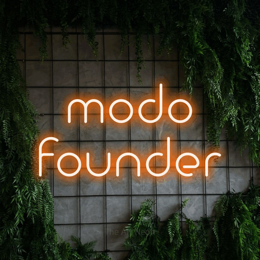 LED neon sign reading “modo founder”, arranged in 2 lines.