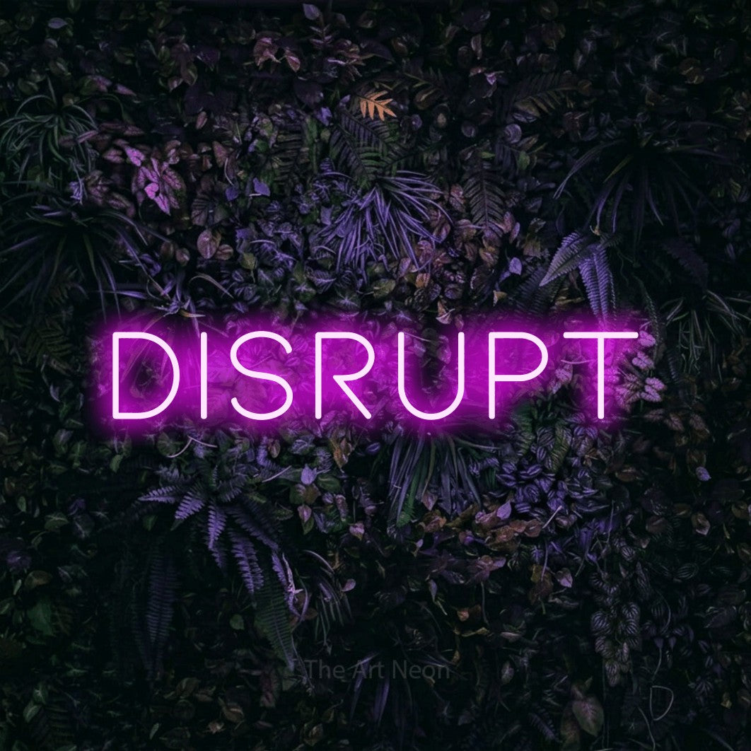 LED neon sign reading “disrupt”, arranged in a single line.