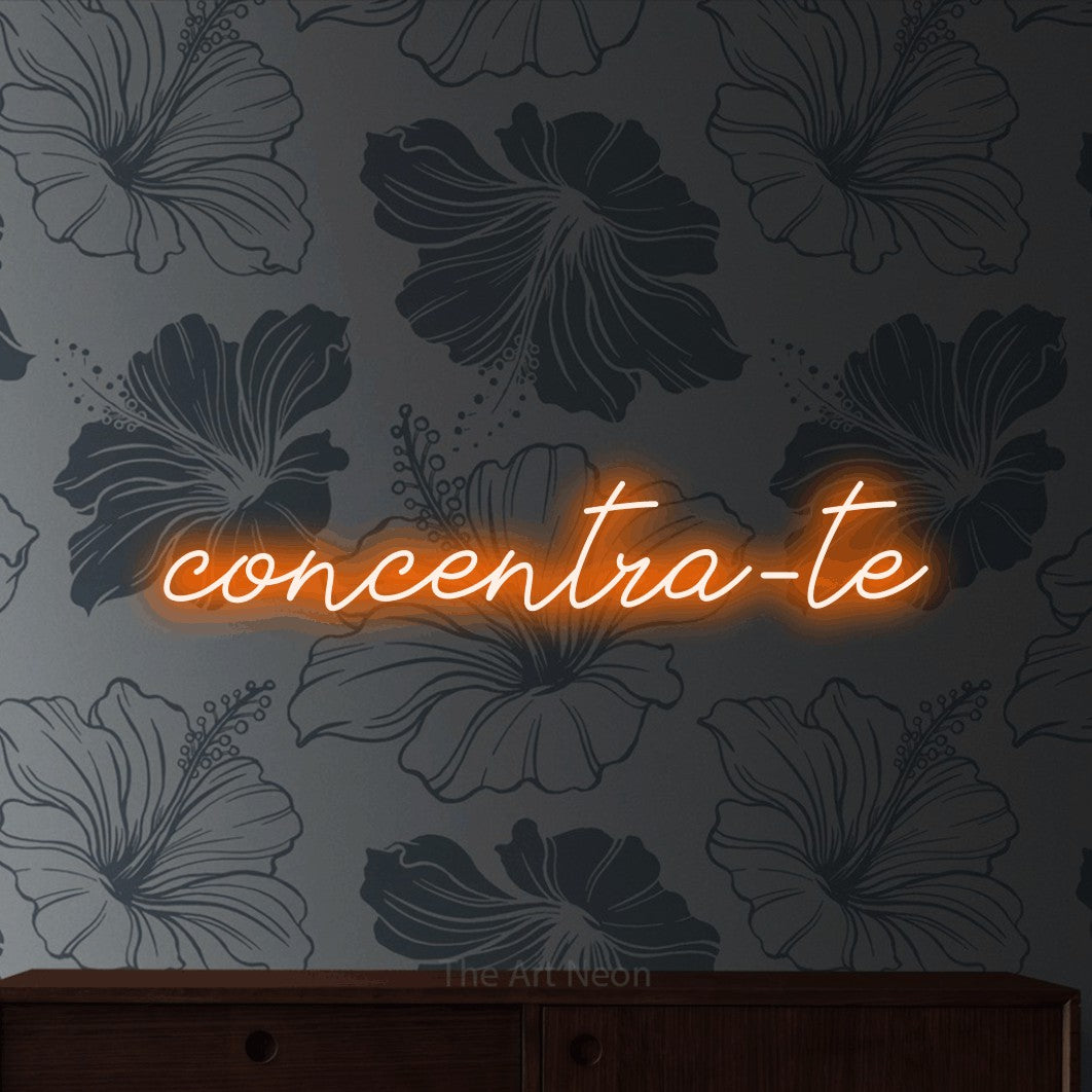 LED neon sign reading “concentra-te”, arranged in a single line.