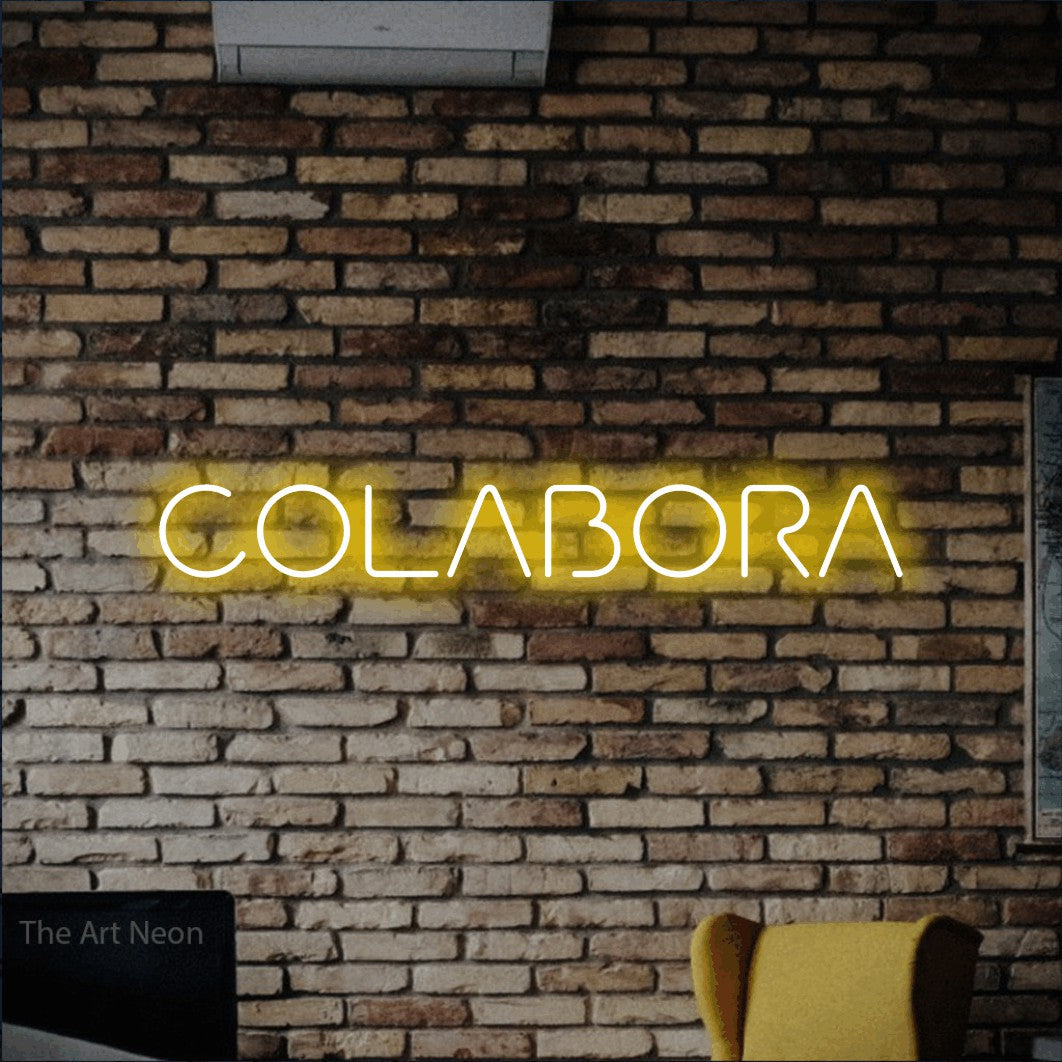 LED neon sign reading “COLABORA”, arranged in a single line.