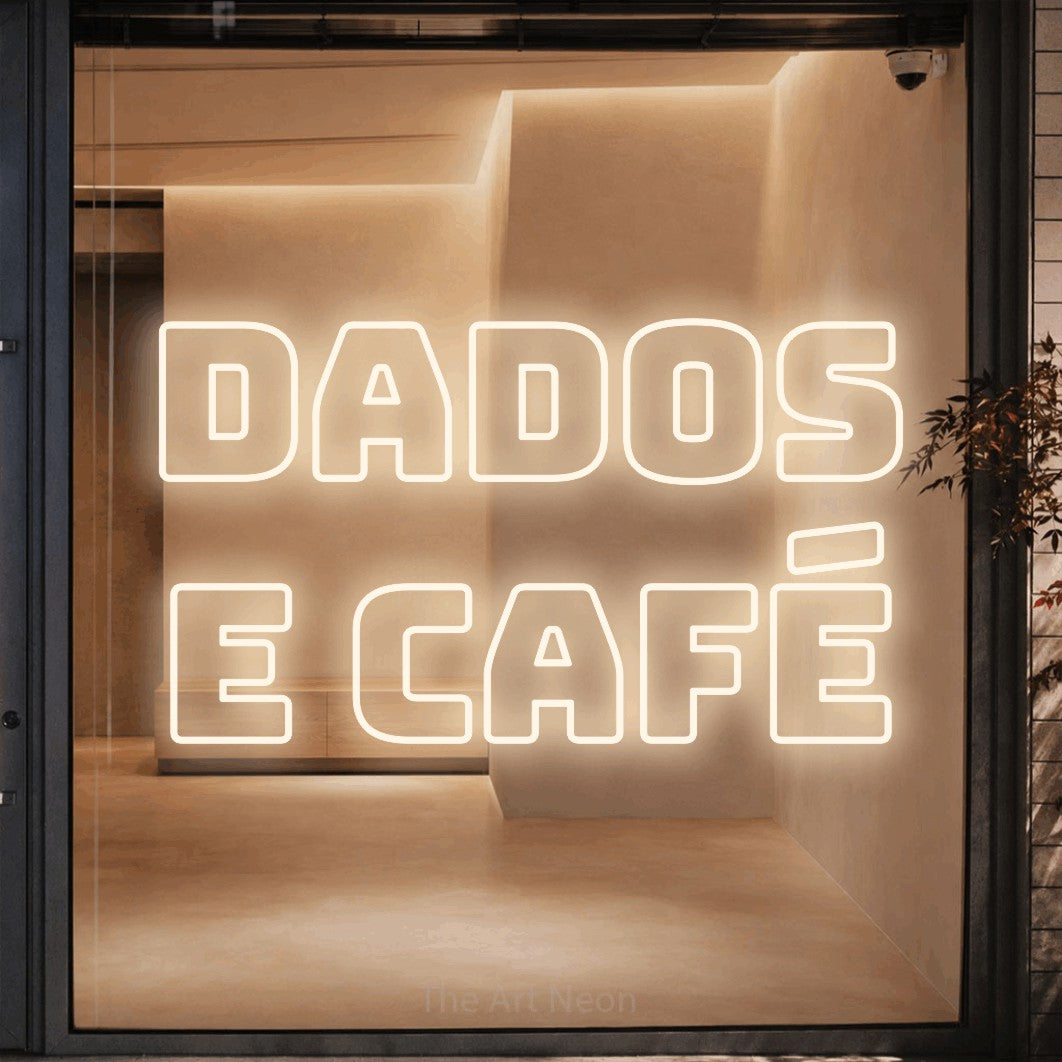 LED neon sign reading “dados e café”, arranged in 2 lines.