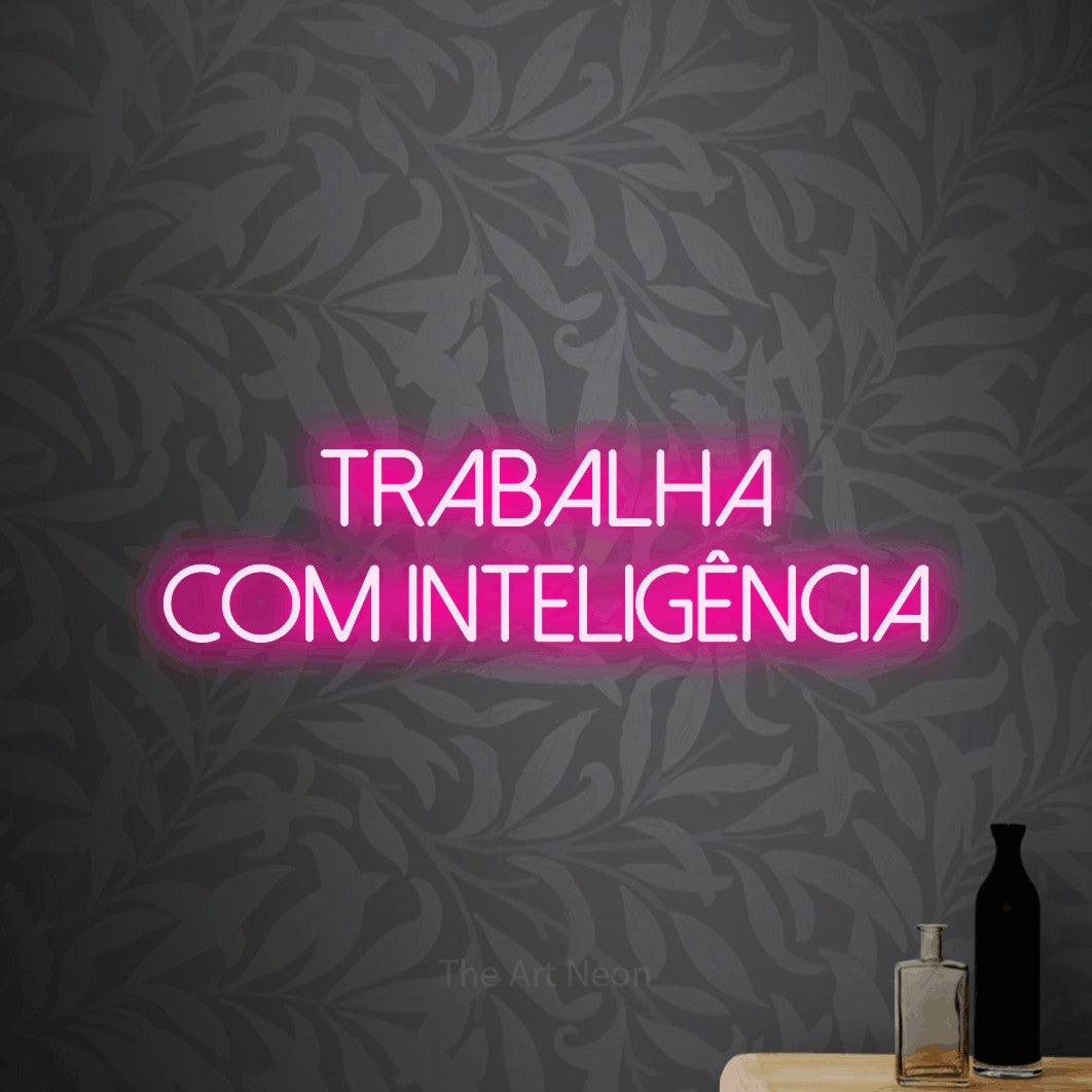 LED neon sign reading “trabalha com inteligência”, arranged in 2 lines.