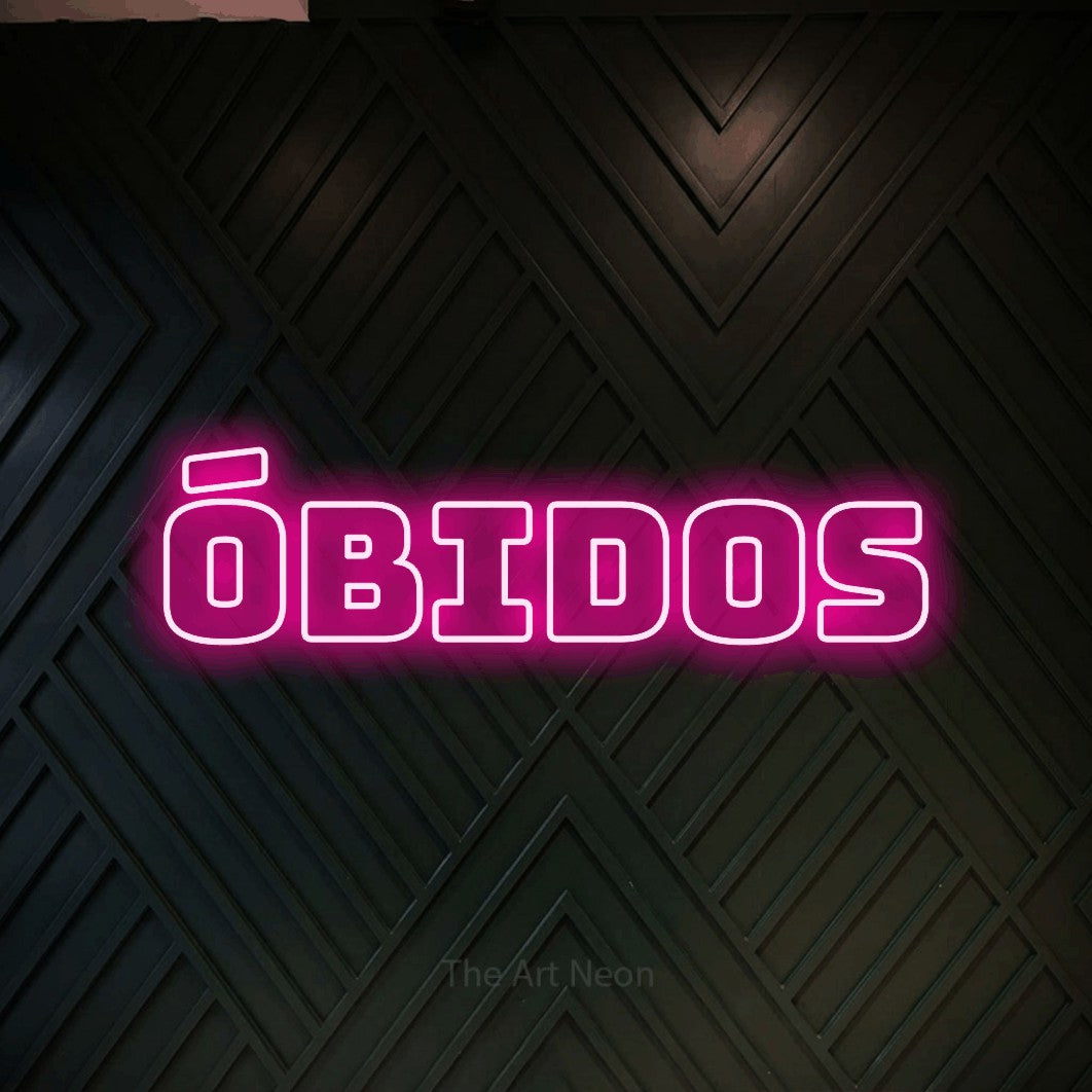 LED neon sign reading “óbidos”, arranged in a single line.