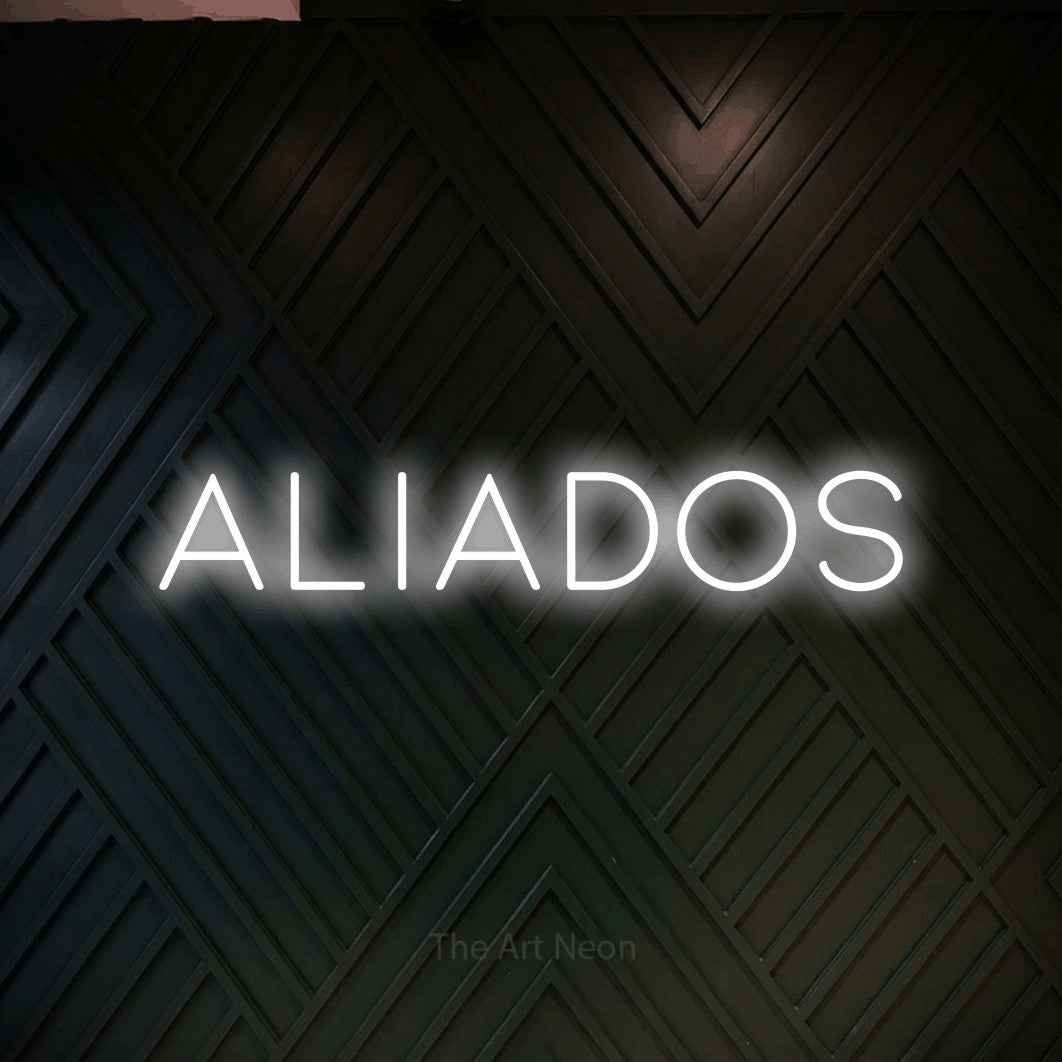 LED neon sign reading “Aliados”, arranged in a single line.