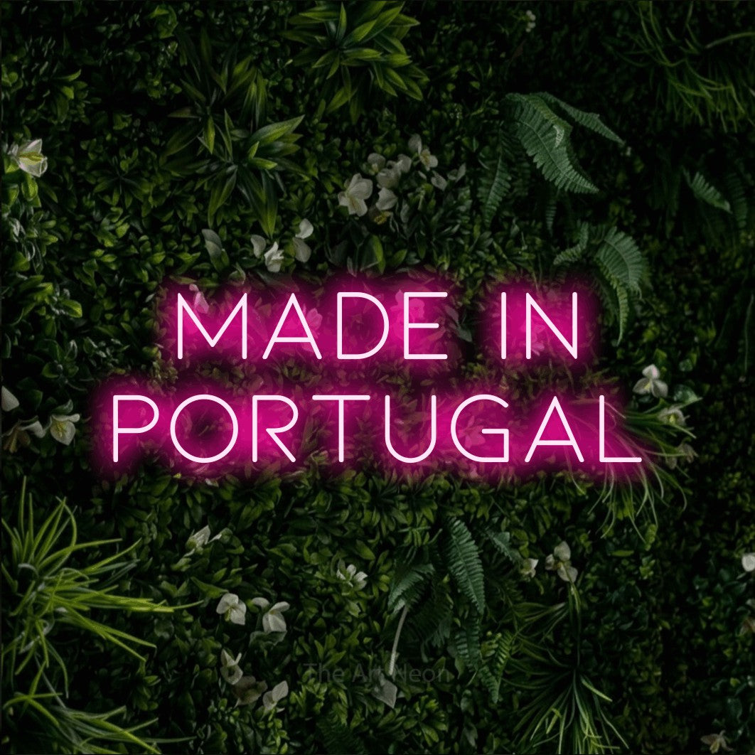 LED neon sign reading “made in portugal”, arranged in 2 lines.