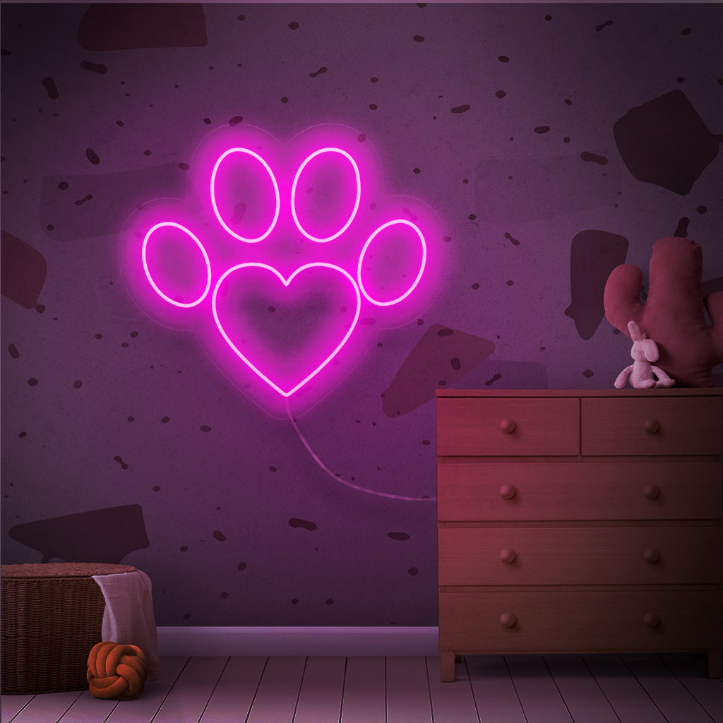 "Placa de Neon com Patinhas" é um toque charmoso e comovente, perfeito para espaços que celebram o amor pelos animais de estimação. Ilumine com o calor de uma patinha!