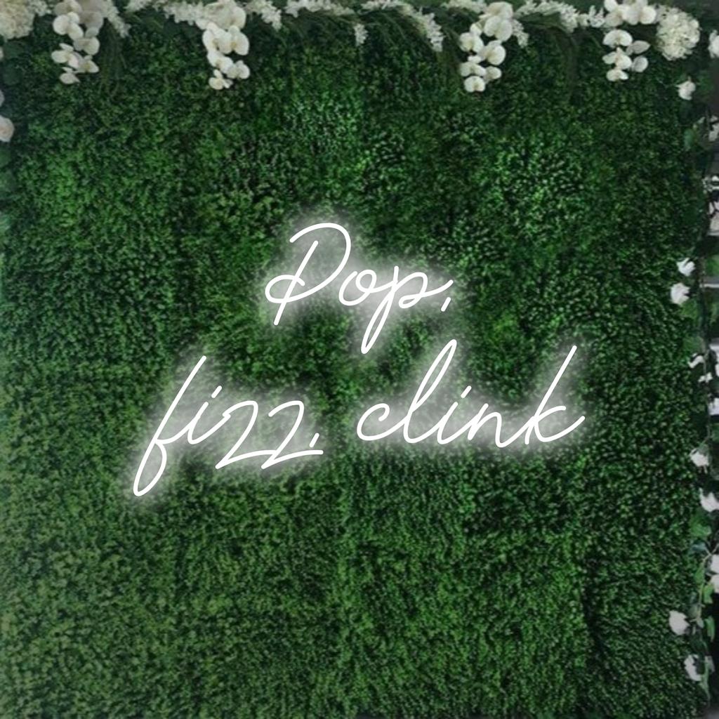 Custom LED Neon Sign reading Pop, Fizz, Clink – vibrant neon light decor adding a playful touch to any space.