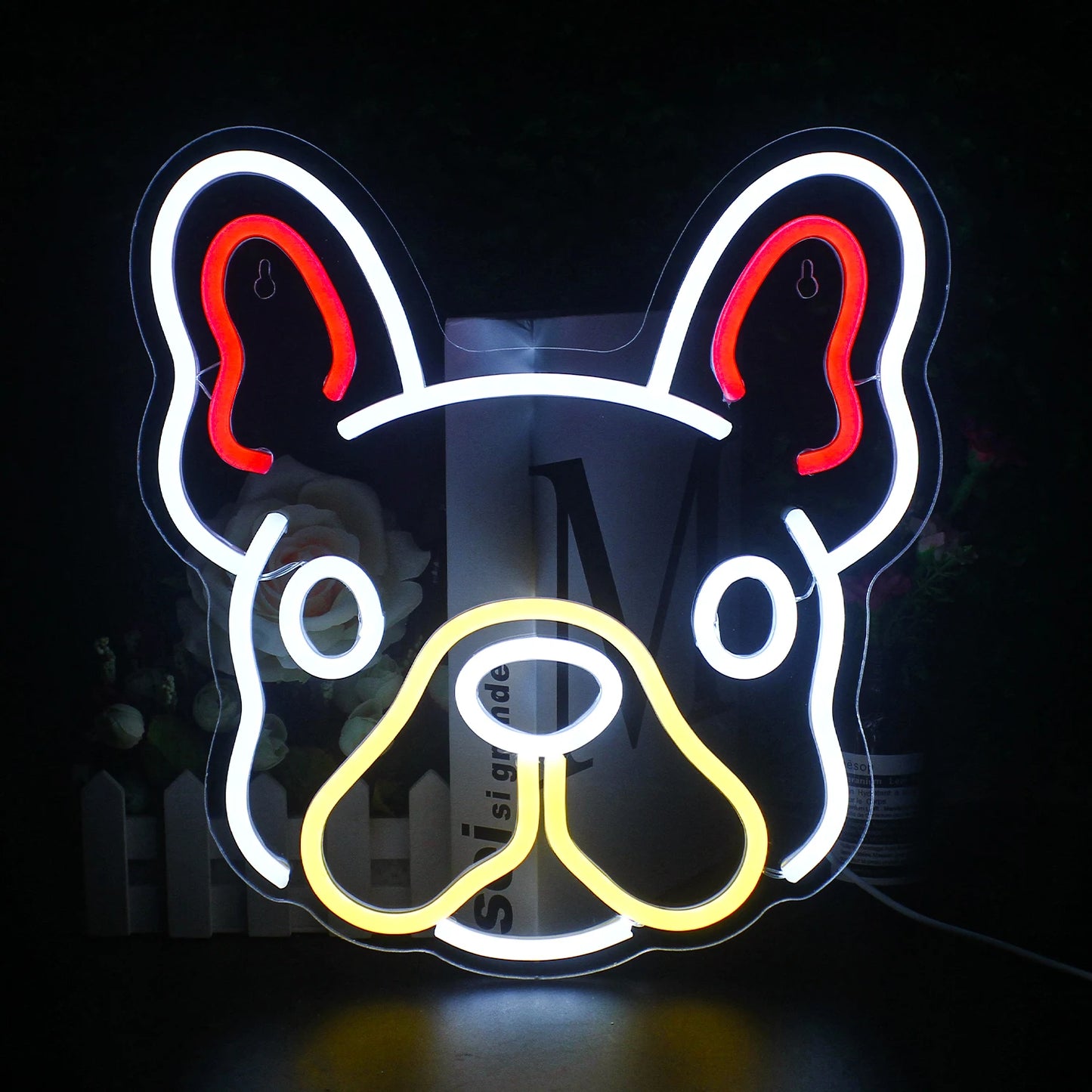 A colorful, handmade LED neon sign in the shape of a cute dog is prominently displayed.