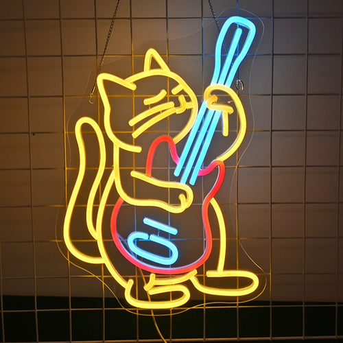 "Um letreiro de neon de LED apresenta um gato em estilo de desenho animado tocando energicamente uma guitarra elétrica.