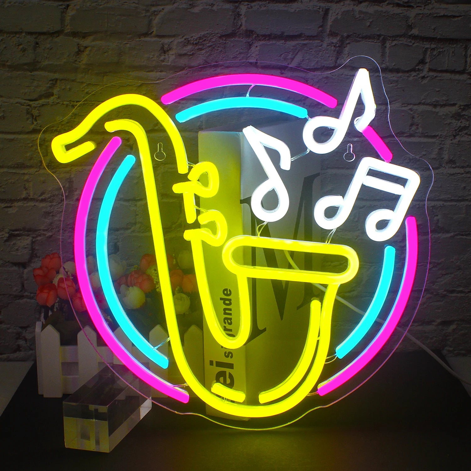 A vibrant LED neon sign shaped like a saxophone is prominently displayed against a dark background.
