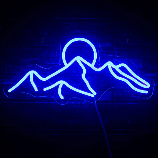 The image displays a vibrant LED neon sign depicting a mountain sunset scene.