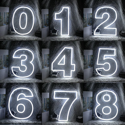The image displays a colorful LED neon sign in the shape of a digital number "7".