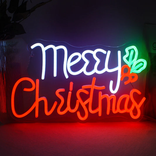 The image depicts a vibrant handmade LED neon sign displaying the words "Merry Christmas" in elegant, cursive lettering.