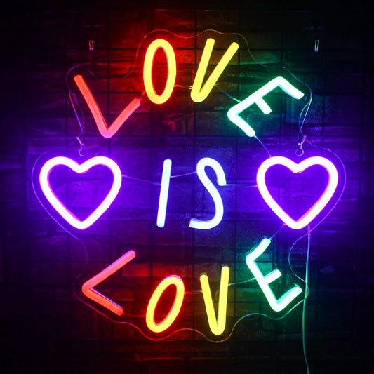 The image showcases a "Love" LED neon sign, beautifully illuminated in a vibrant pink hue.