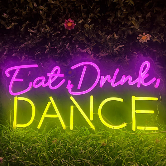 The image displays a vibrant, handmade LED neon sign featuring the words "Eat Drink Dance" in a lively font.