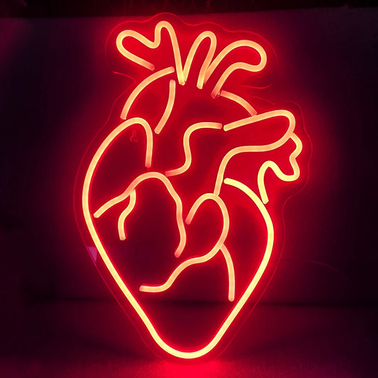 A brightly lit LED neon sign in the shape of a heart.