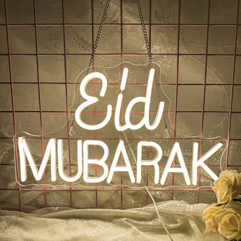 A vibrant and colorful "Eid Mubarak" LED neon sign featuring elegant, handwritten script.