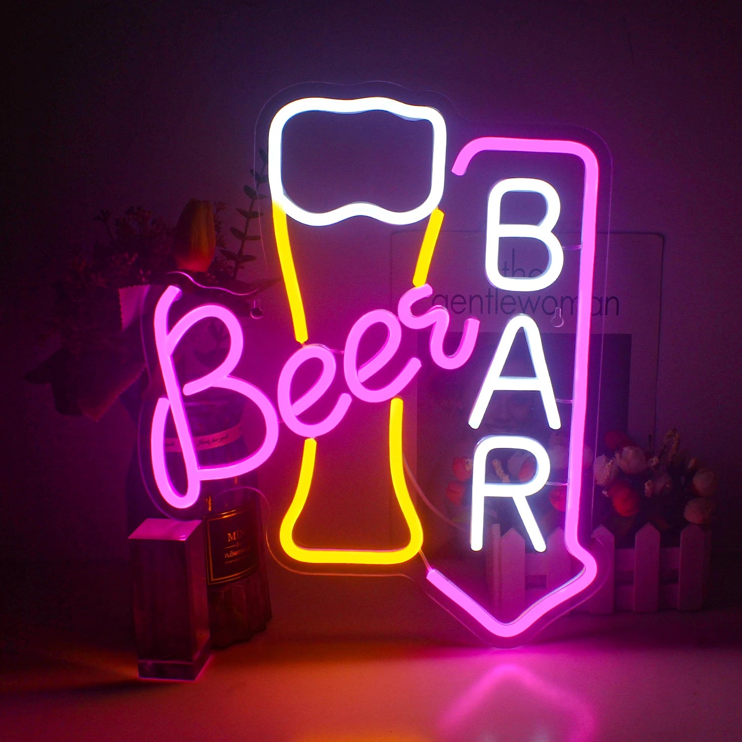 A vibrant LED neon sign displaying the word "Beer Bar" in bold, uppercase letters.
