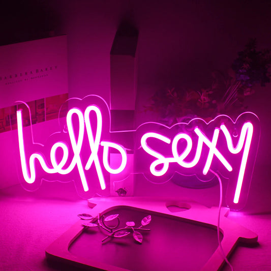 The image features a vibrant "Hello Sexy" LED neon sign.