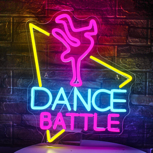 The image features a vibrant LED neon sign with the phrase "Dance Battle" prominently displayed.
