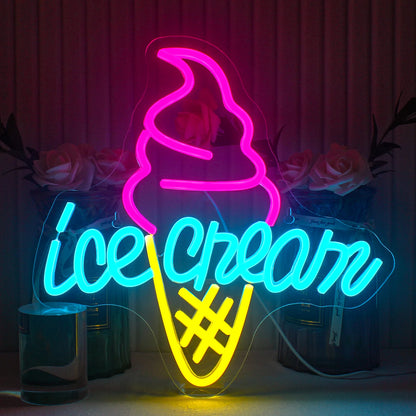 The image displays a vibrant, handmade LED neon sign in the shape of an ice cream cone.