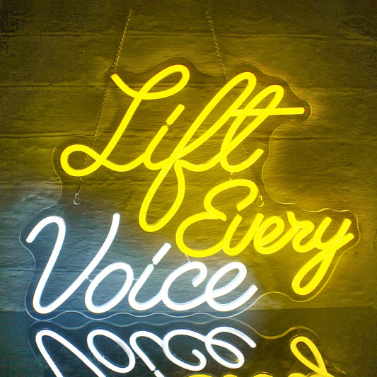 A vibrant LED neon sign displaying the phrase "Lift Every Voice" in elegant cursive lettering.