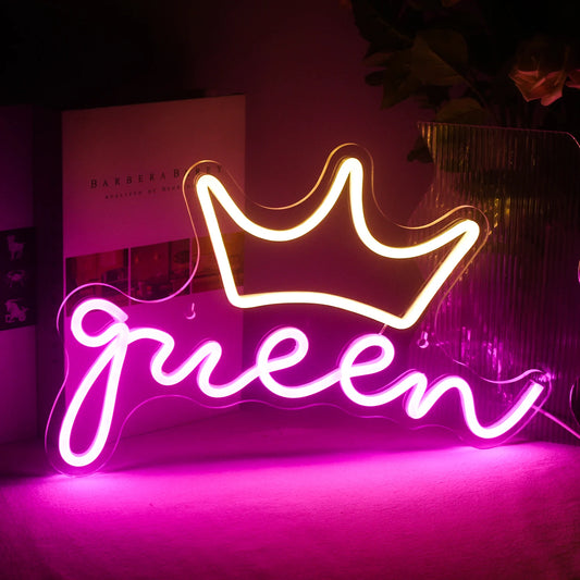 A vibrant LED neon sign in the shape of the word "Queen" is displayed.
