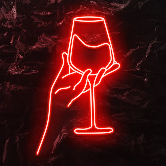The image displays a vibrant LED neon sign depicting a stylized red wine glass.