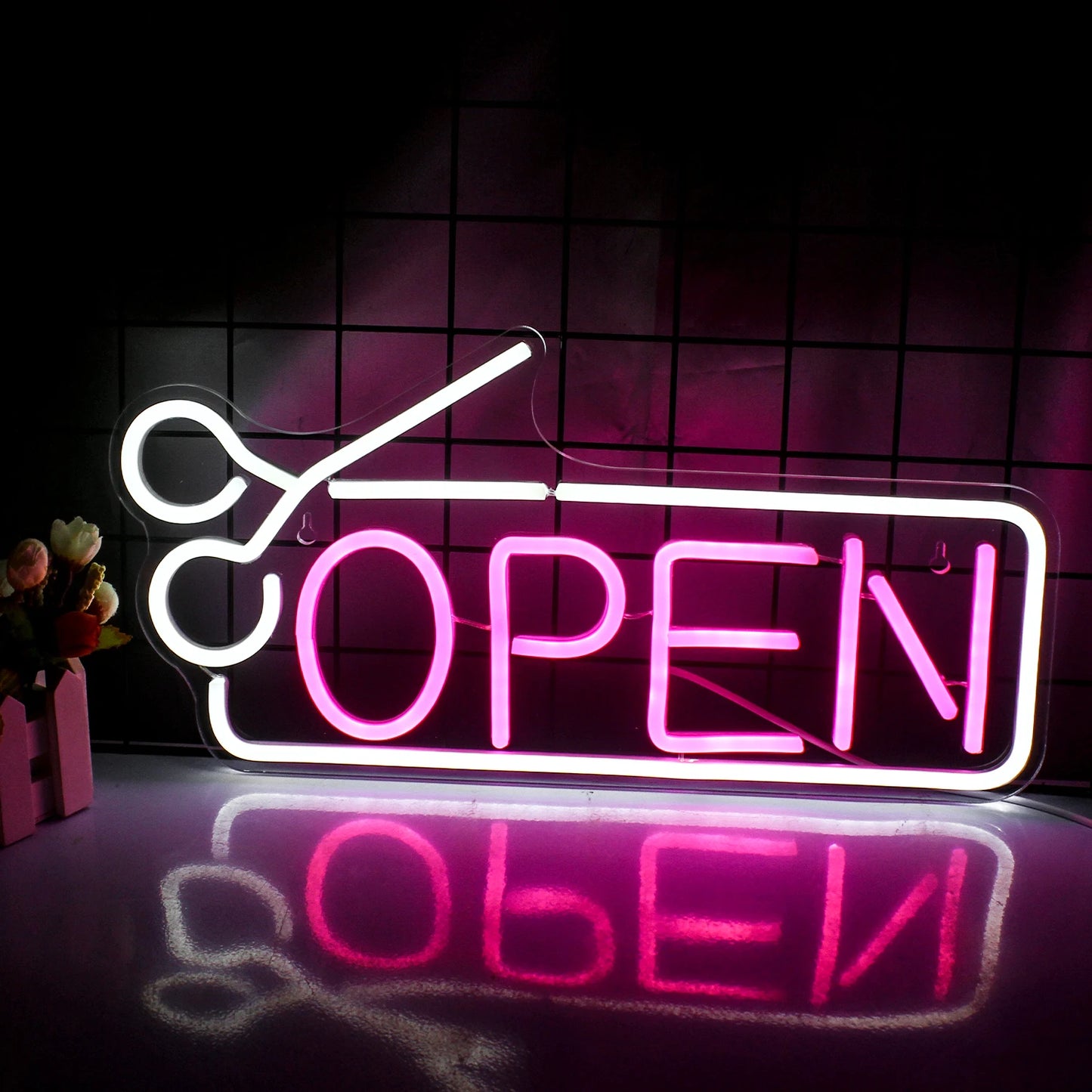 The image features a vibrant, handmade LED neon sign in bold, eye-catching colors.