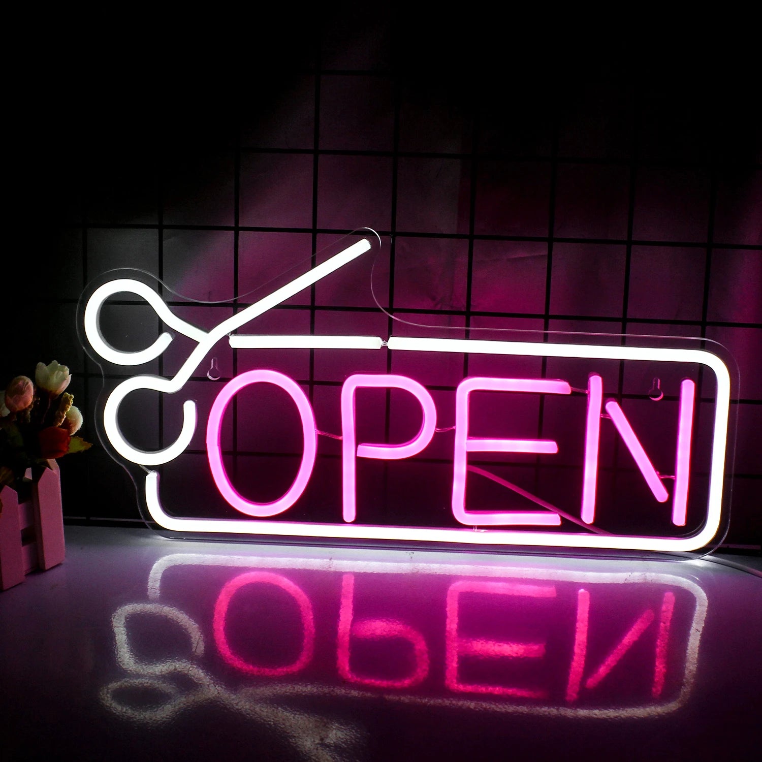 The image features a vibrant, handmade LED neon sign in bold, eye-catching colors.