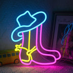 The image features a Cowboy Boot LED Neon Sign, showcasing a vibrant, glowing outline of a classic cowboy boot.