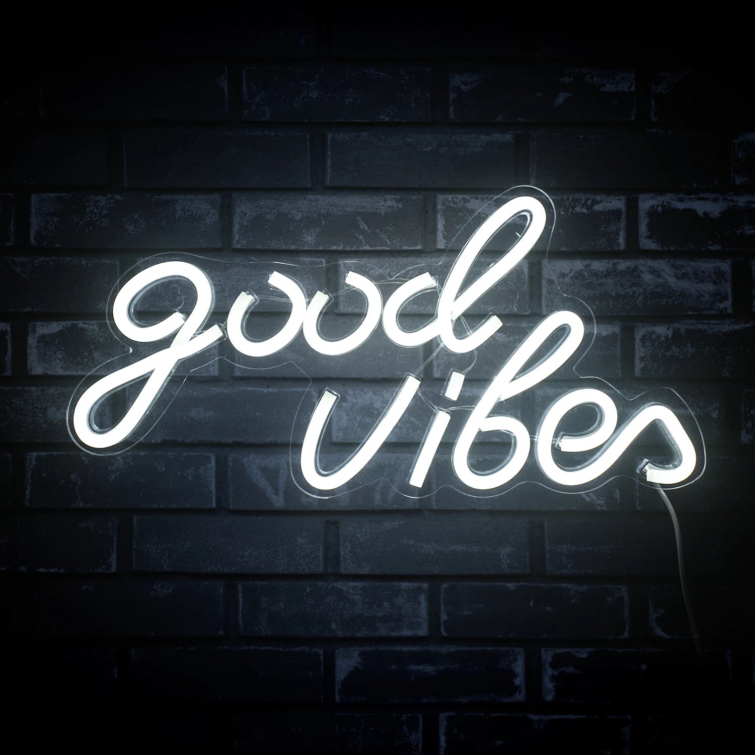 The image features a handcrafted LED neon sign displaying the words "Good Vibes" in a stylish, cursive font.
